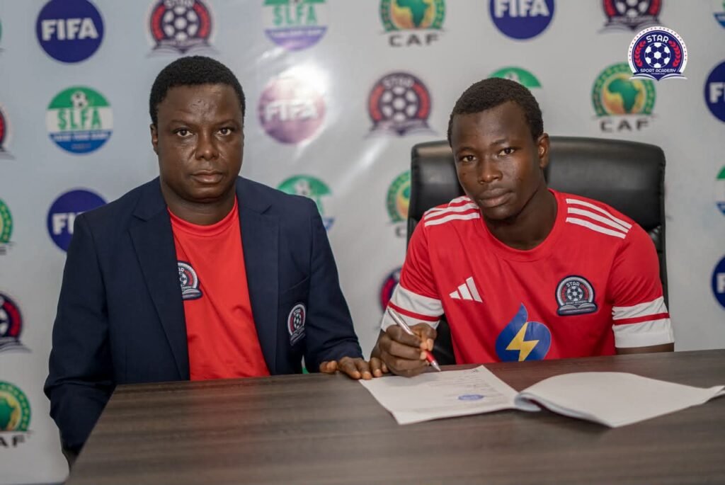 Our CEO, MJT, Esq and Striker Bangura during the signing process!