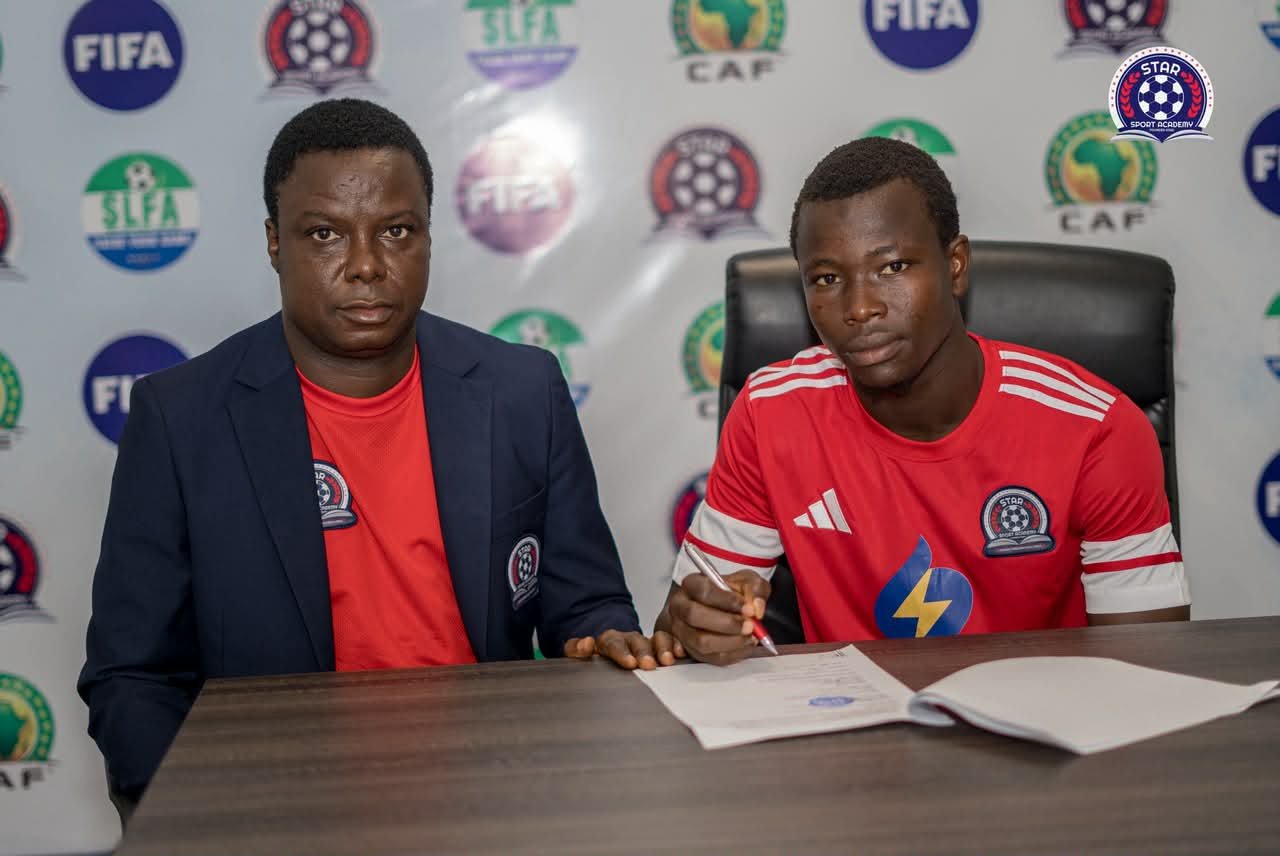 Our CEO, MJT, Esq and Striker Bangura during the signing process!